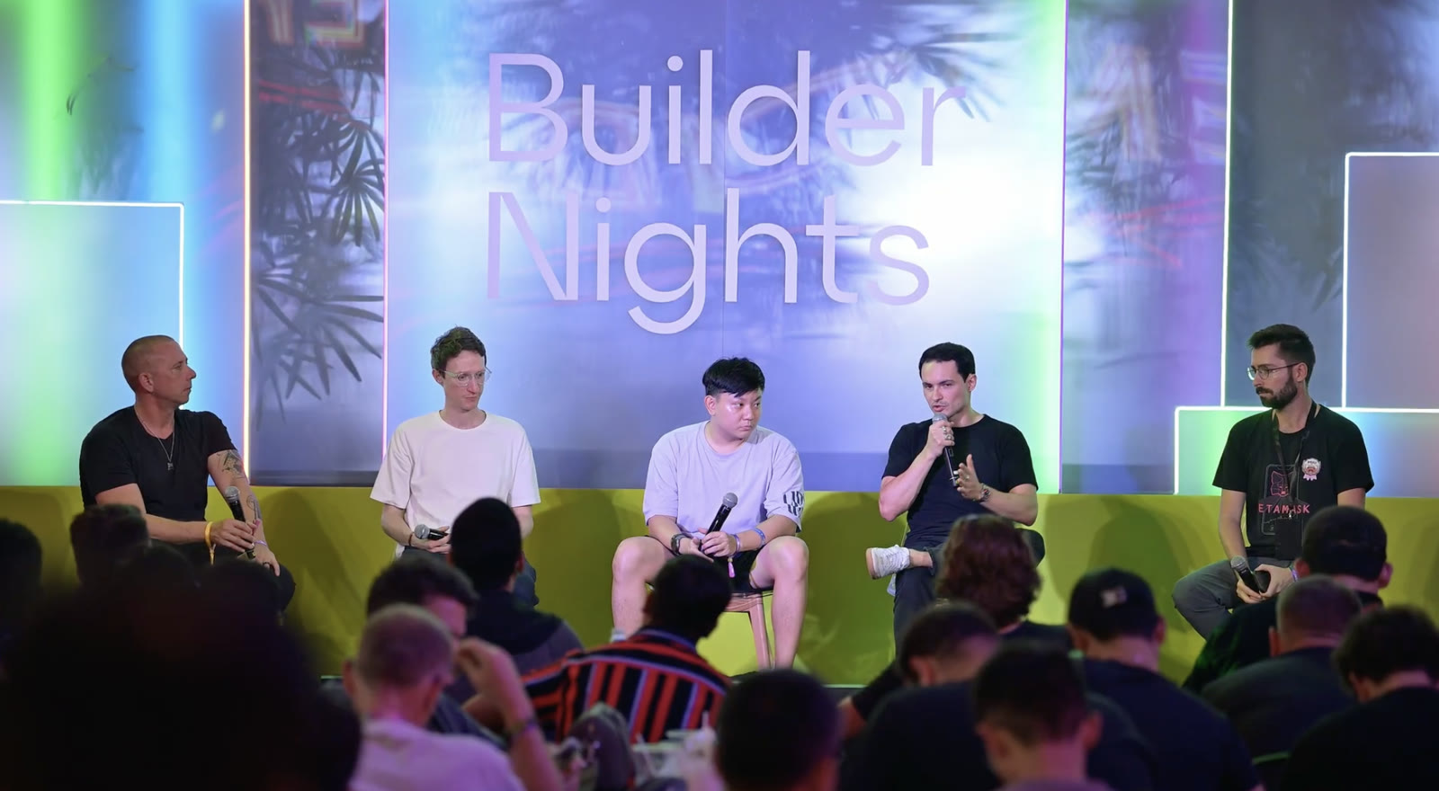 The Builder Nights panel on stage in Bangkok, with Edgar Roth speaking